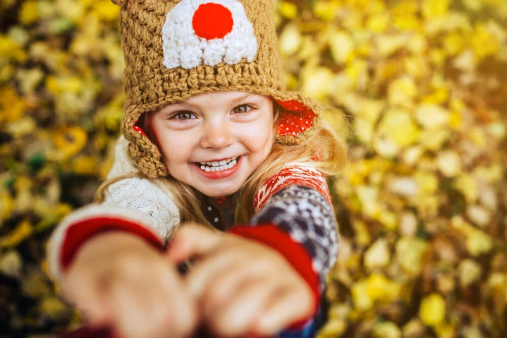 Girl Laughing Front Background Yellow Leaves (1)